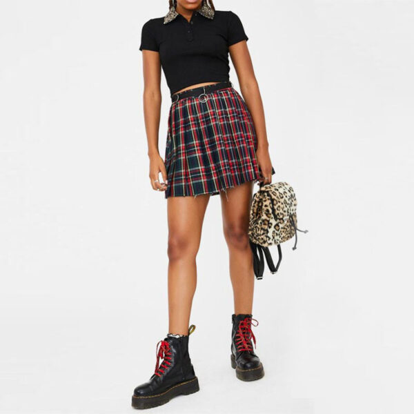 a women in a plaid skirt and boots